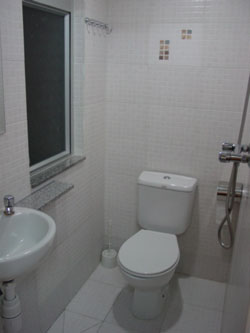 Clean and spacious toilet in every room.