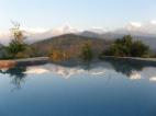 Infinity pool reflects Himalayas
