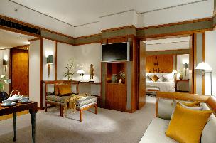 Deluxe Suites offer views of the water garden and city.
