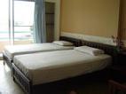 Double beds room with balcony on the river side.