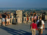 Visitors to the terrace lookout of Parc de Mont-Royal check out the Montreal cityscape.