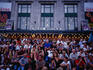 An audience sitting out the front of the Palais Montcalm, watching a performance during the Music and Comedy Festival held annually in August.
