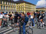 A tour group cycles through the historic city of Munich.