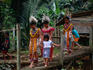 Traditionally clothed women leave the NG Lalang long house to greet visitors to the Goodwill Festival of Skrang River.