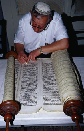Rabbi restoring a 300 year old Torah. The Torah is a sacred Judaic scripture- Izmir, Izmir province, Turkey