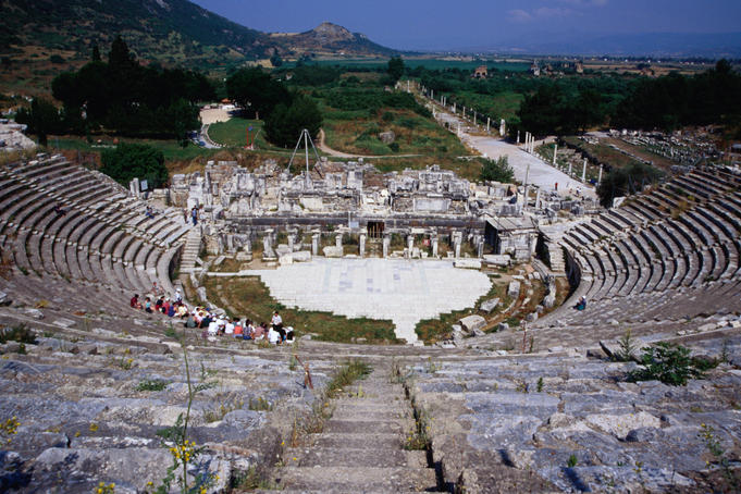 The Great Theatre at Ephesus. Completed by the Romans in 117 AD, the theatre is still used for performances today. Leading out from behind the theatre is Harbour Street- Ephesus, Izmir province, Turkey