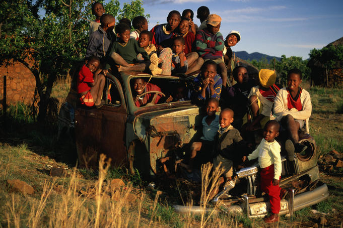 An overland trek that didn't quite make it, children from the village of Malealea make good use of an abandoned truck