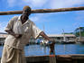 A Dhow captain, standing in his boat of the Zanzibar Island