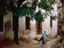 A boy cycling past Tibbu Tib's House on Zanzibar Island