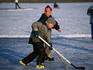 Boys playing ice hockey on frozen Katzensee (lake) on the outskirts of Zurich.