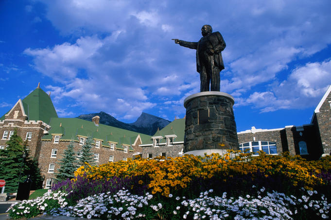A statue in gardens at the front of the Banff Hotel.