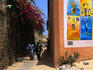Brightly painted walls and narrow alleys of Ile de Goree.