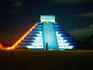 Pyramid of Kukulcan (Plumed Serpent) illuminated by neon lights.