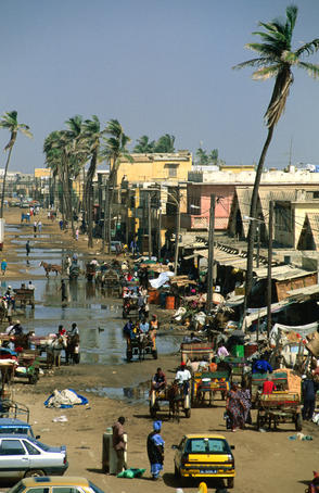 People going about their business in street.