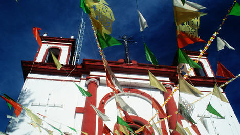 Flags in front of San Cristobel church.