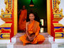 Buddhist monks in doorway at Wat Chalong.