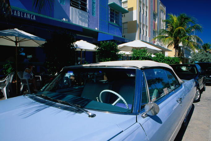 Classic American car parked in front of the Casablanca Hotel on Ocean Drive.