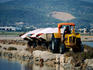 La Canac: Tractor on the coast with trailers full of salt, Ses Salines.