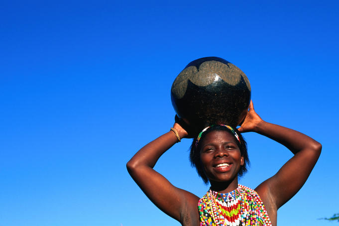Zulu woman carrying beer pot.