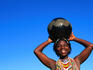Zulu woman carrying beer pot.