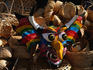 Devil masks and baskets in a craft shop.