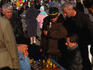 Men play and watch a game of chess on the Palace Square in St Petersburg
