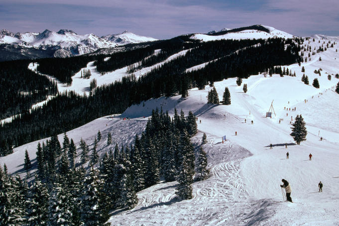 Snow covered ski run in Rocky Mountains.