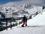 Ski run and sign on Rendezvous Peak in Teton Range of Rocky Mountains.