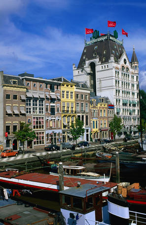 Witte Huis with flags and Mariners Museum alongside waters of Oude Haven.