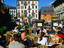 Outdoor dining in sunshine on main square of Place Balmat.