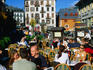 Outdoor dining in sunshine on main square of Place Balmat.