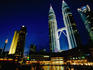Petronas Towers in night city skyline.