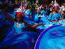 People in costume dancing at Notting Hill Gates annual carnival.