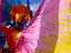 Man in colourful costume at Notting Hill Gates annual carnival.