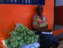 Local lady selling beans on the streets of Port of Spain.