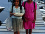 Mayan girls selling trinkets on dock.