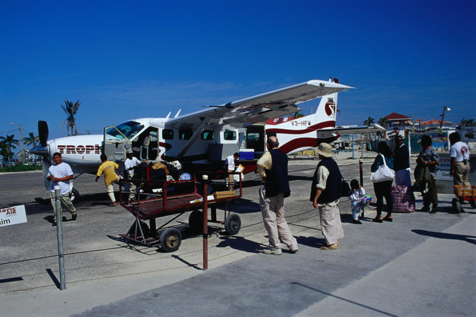 Loading Tropic Air flight at airport.
