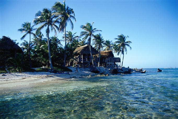 Beachfront huts at Glovers Reef.