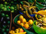 A selection of tropical fruit for sale at a fruit stand along the highway.