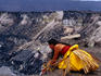 A local woman placing offerings to the Fire Goddess, Pele, during a ceremony at the Halemaumau Crater.