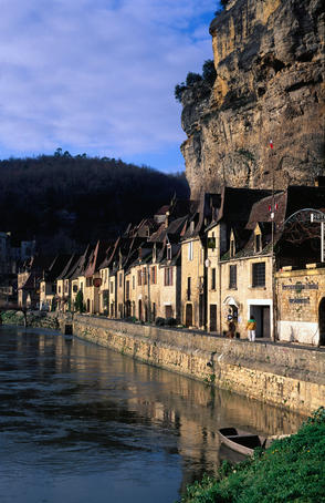 Waterfront buildings on the bank of the Dordogne River.