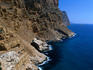 Rugged cliffs along coast at Ponta de l'Escaleta in Benidorm (Costa Blanca), Alicante.
