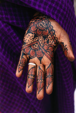 Henna hand tattooes are thought to enhance the beauty and are often applied