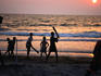 Kids playing beach cricket in Arambol.