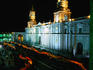 A candlelit procession makes its way around the Plaza de Armas.