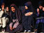 Young women of Tehran in traditional chador, which literally means 
