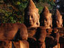 Giant statues line the road at the entrance to the South Gate, one of five monumental 20m gates into the fortified city of Angkor Thom.