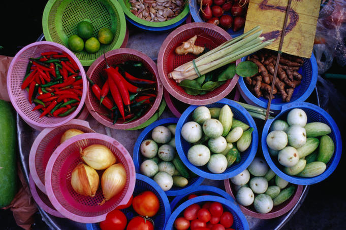 Vegetables, chilies, limes at an outdoor restaurant at Tha Chang Pier in Ratanakosin.