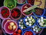 Vegetables, chilies, limes at an outdoor restaurant at Tha Chang Pier in Ratanakosin.