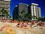 People sun baking on the beach - Waikiki, Hawaii